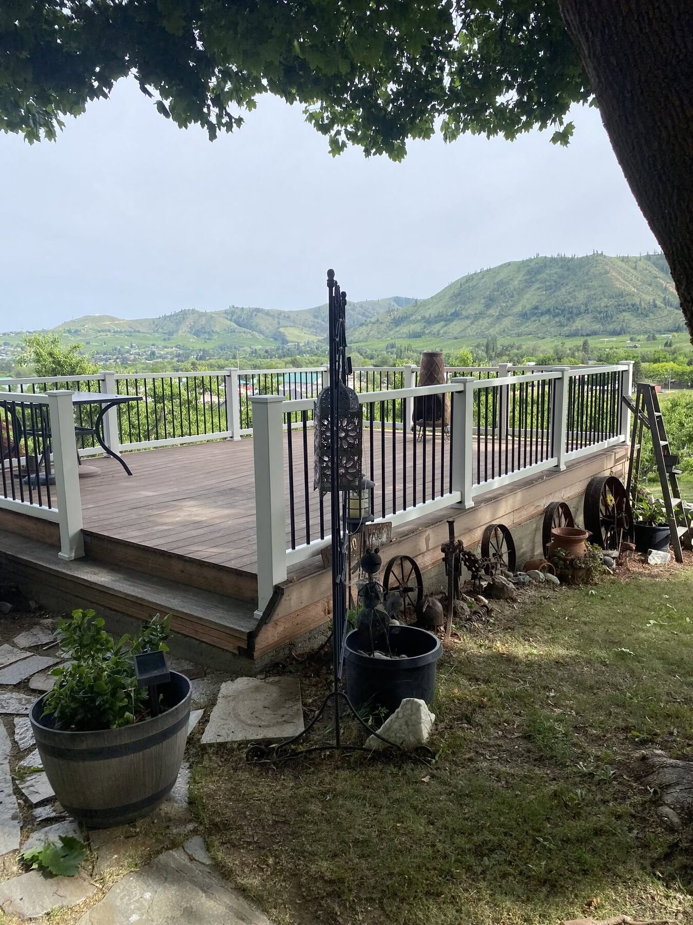 Composite view deck with white aluminum railing and black balusters