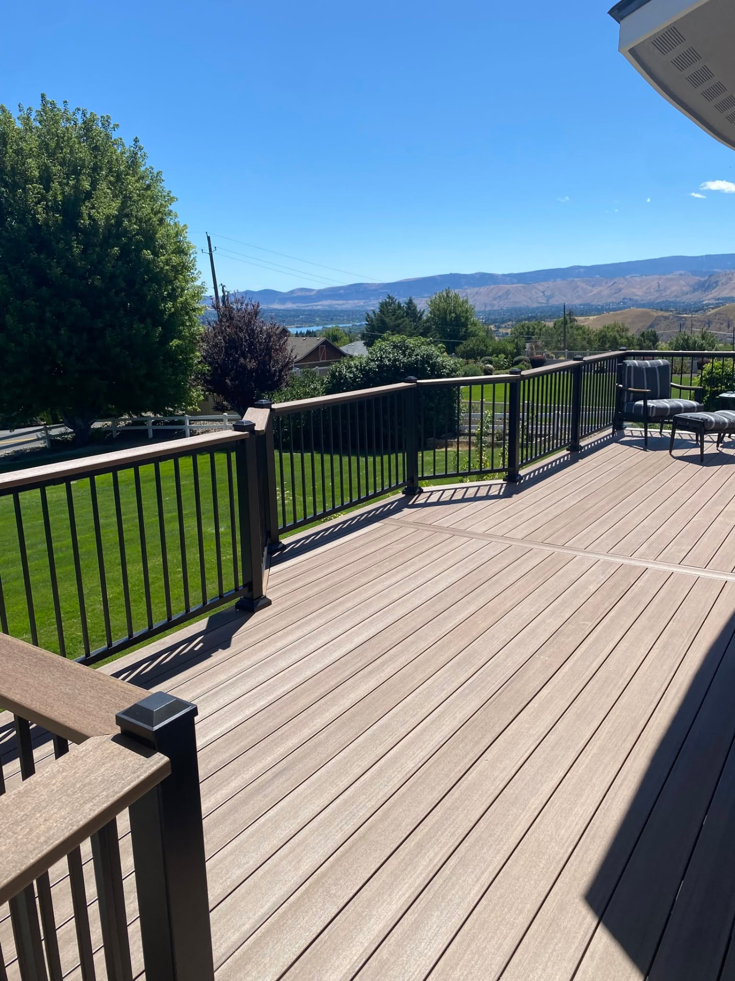 Composite deck with black railing and stairs built in Wenatchee, WA — view 2