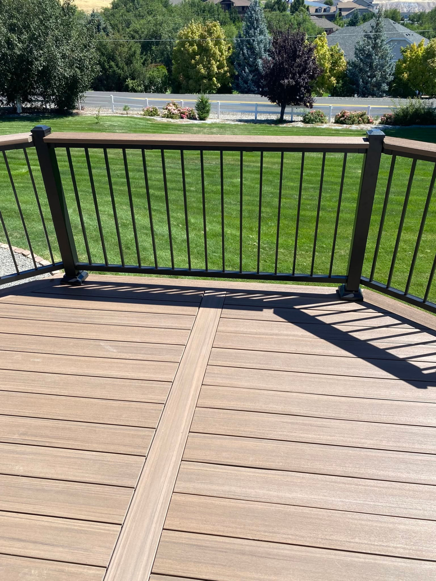 Composite deck with black railing and stairs built in Wenatchee, WA — view 3