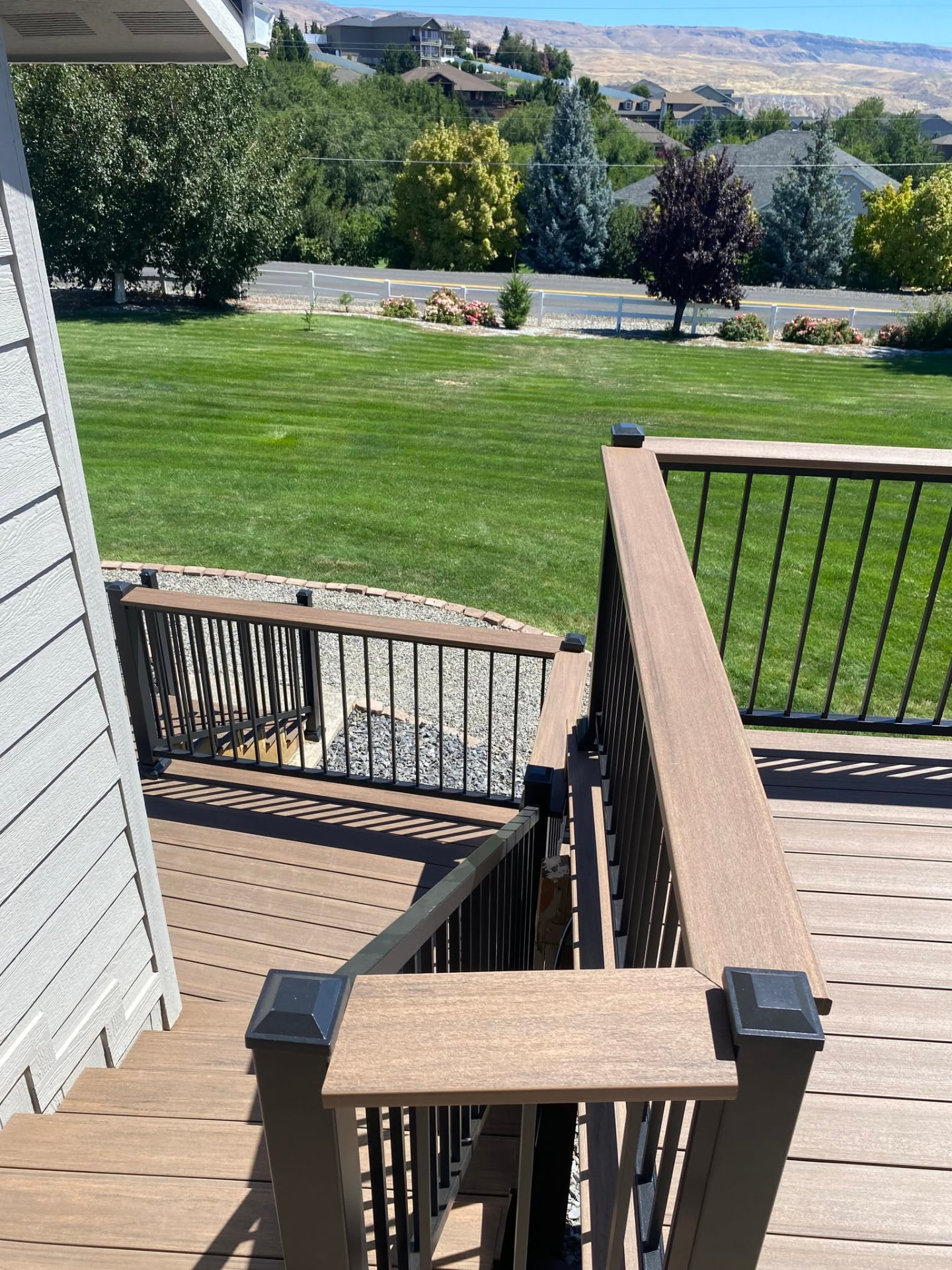 Composite deck with black railing and stairs built in Wenatchee, WA — view 7